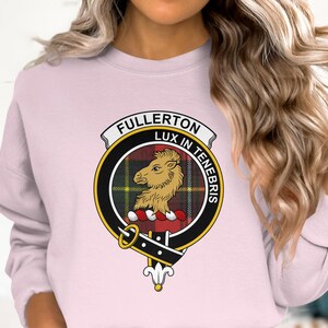 Pink sweatshirt with Fullerton clan crest featuring a lion and Latin motto.