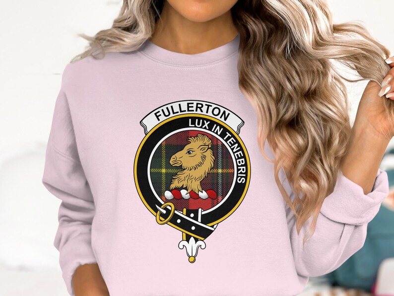 Pink sweatshirt with Fullerton clan crest featuring a lion and Latin motto.