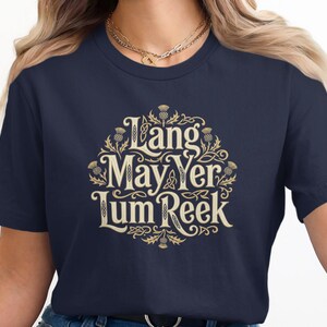 Dark blue t-shirt with "Lang May Yer Lum Reek" text and Celtic knot design.