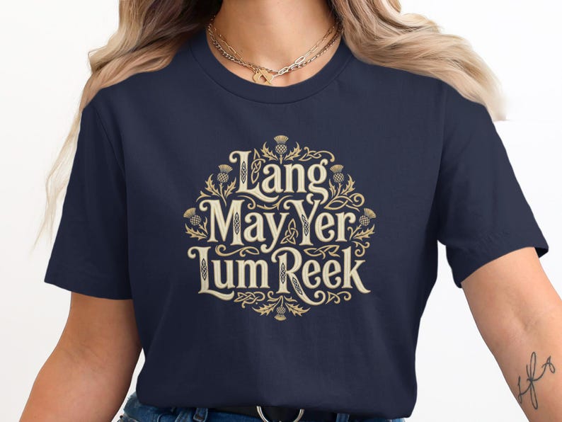 Dark blue t-shirt with "Lang May Yer Lum Reek" text and Celtic knot design.