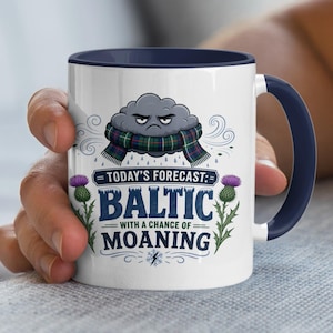 May include: White ceramic mug with a navy blue interior and handle. The mug features a cartoon cloud wearing a scarf, with the text "TODAY'S FORECAST: BALTIC WITH A CHANCE OF MOANING". Thistles are on either side.