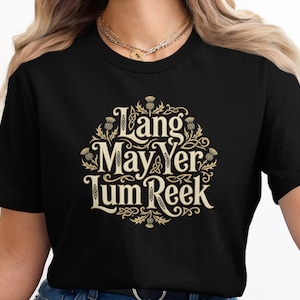 Black t-shirt with gold Celtic knot design and Scottish text.