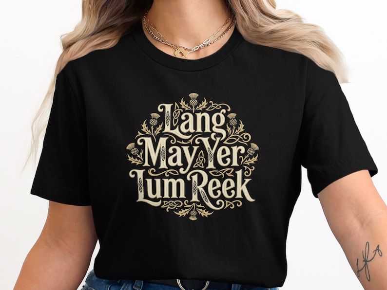 Black t-shirt with gold Celtic knot design and Scottish text.