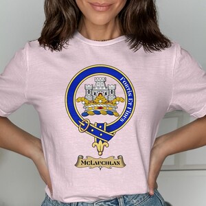 Pink t-shirt with the McLauchlan clan crest featuring a castle and motto.