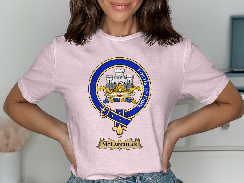 Pink t-shirt with the McLauchlan clan crest featuring a castle and motto.