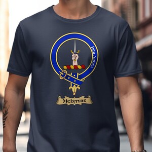 McIntyre clan crest on a navy blue t-shirt with motto "Per Ardua".