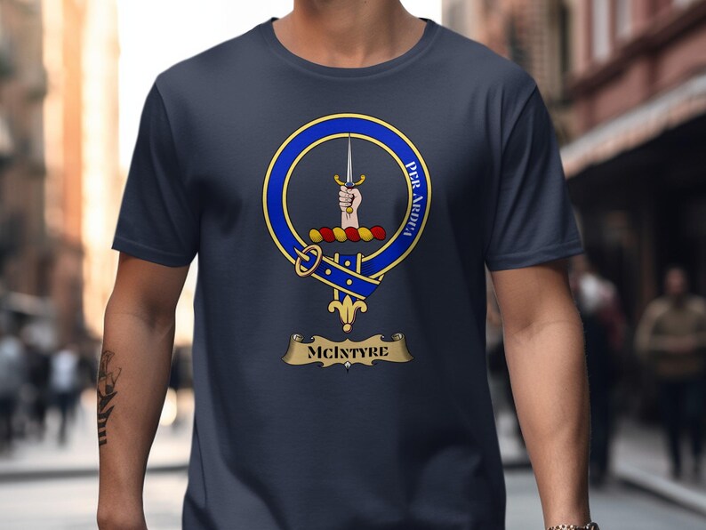 McIntyre clan crest on a navy blue t-shirt with motto "Per Ardua".