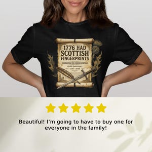 Black t-shirt with "1776 Had Scottish Fingerprints" 250th anniversary design.