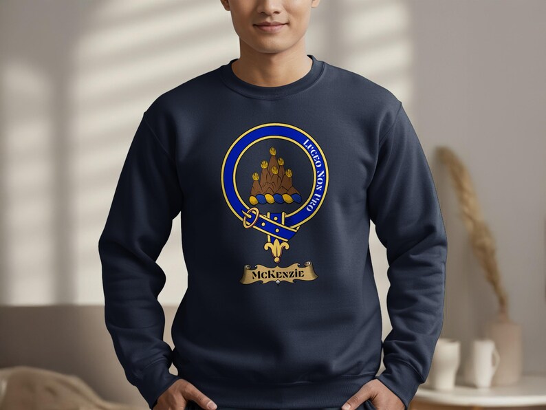 Navy sweatshirt with McKenzie clan crest and motto "Lucem Non Fro".