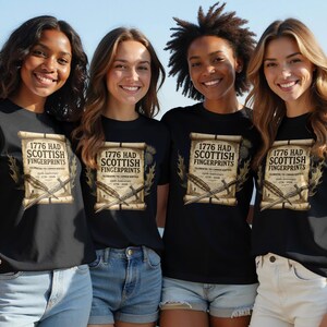 Four women wear black t-shirts with "1776 Had Scottish Fingerprints" design.