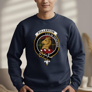 Dark blue sweatshirt with Fullerton Lux In Tenebris clan crest on the chest.
