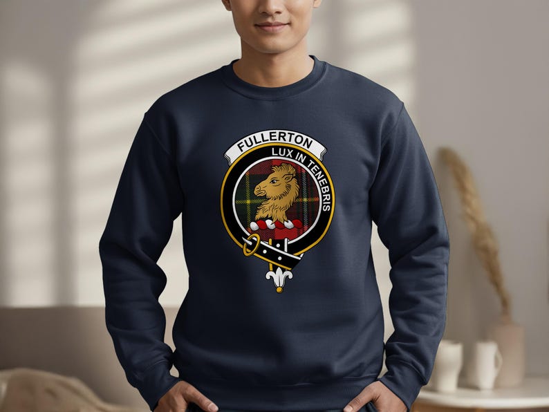 Dark blue sweatshirt with Fullerton Lux In Tenebris clan crest on the chest.