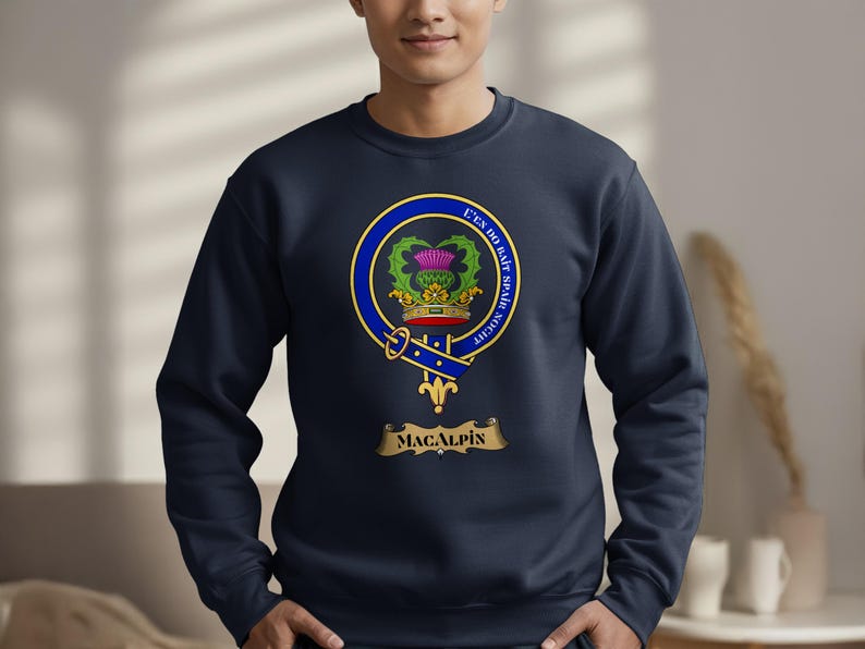 Navy sweatshirt featuring the MacAlpine clan crest on the chest.