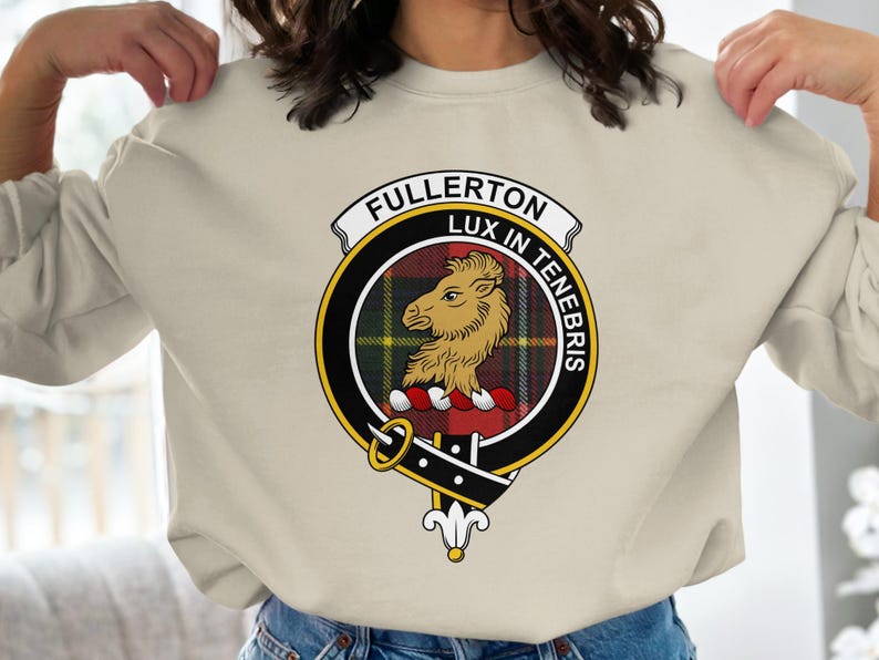 Cream sweatshirt with Fullerton Lux In Tenebris clan crest featuring a lion.