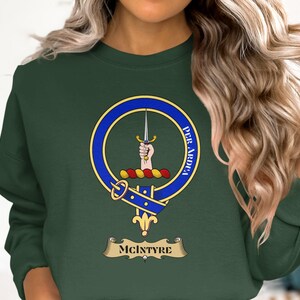 McIntyre clan crest on dark green crewneck sweatshirt.