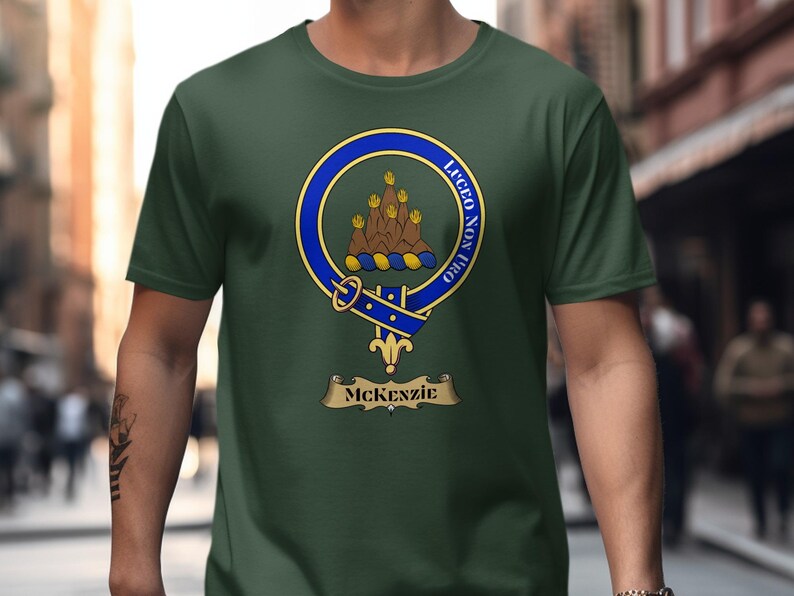 Green t-shirt with McKenzie clan crest featuring a hand and motto.