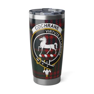 May include: A stainless steel travel mug with the Cochrane family crest. The crest features a white horse, a banner with the words "Virtute et Labore", and the name "Cochrane". The background is a red and green tartan pattern.