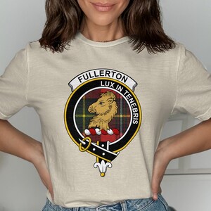 Beige t-shirt featuring the Fullerton clan crest with motto "Lux in Tenebris".