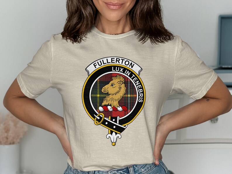 Beige t-shirt featuring the Fullerton clan crest with motto "Lux in Tenebris".