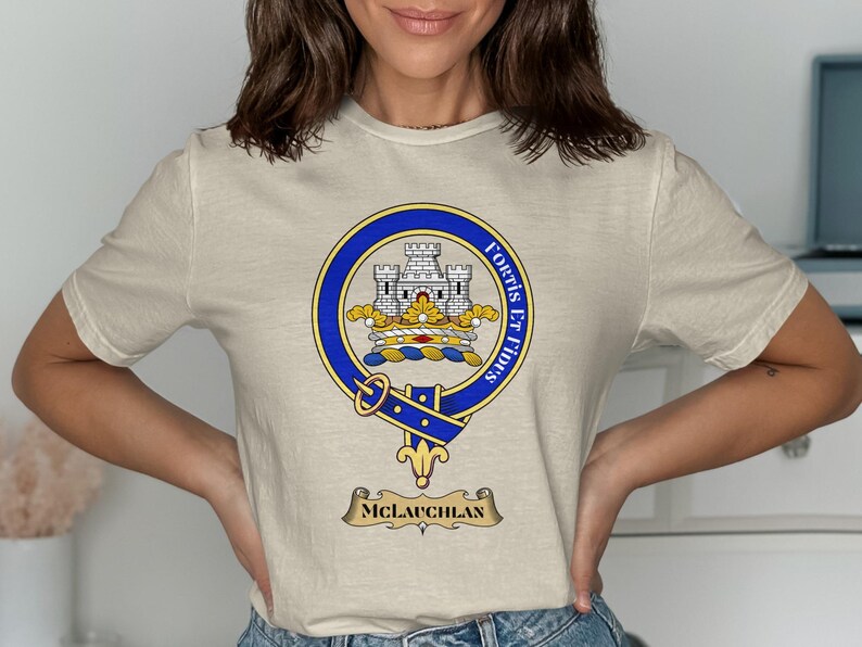 T-shirt with a crest featuring a castle, banner reading "Fortis Et Fidus," and "MCLAUGHLAN" below.