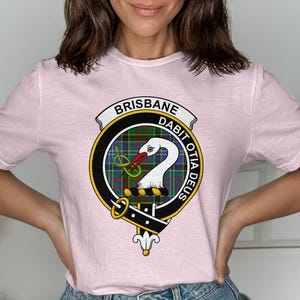 Pink t-shirt with Brisbane coat of arms featuring a swan and motto.