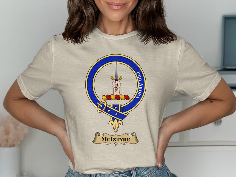 Cream t-shirt with McIntyre clan crest and motto "Per Ardua".