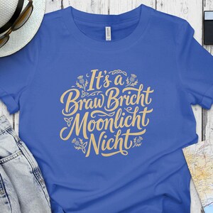 Blue t-shirt with yellow text "It's a Braw Bricht Moonlicht Nicht".