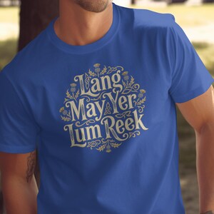Blue t-shirt with "Lang May Yer Lum Reek" text and thistle design.