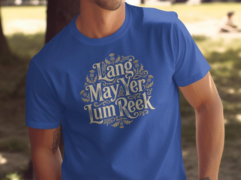 Blue t-shirt with "Lang May Yer Lum Reek" text and thistle design.