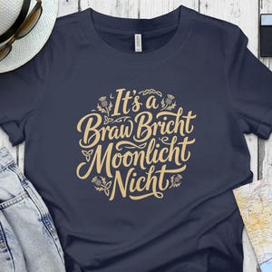 Navy t-shirt with "It's a Braw Bricht Moonlicht Nicht" lettering.