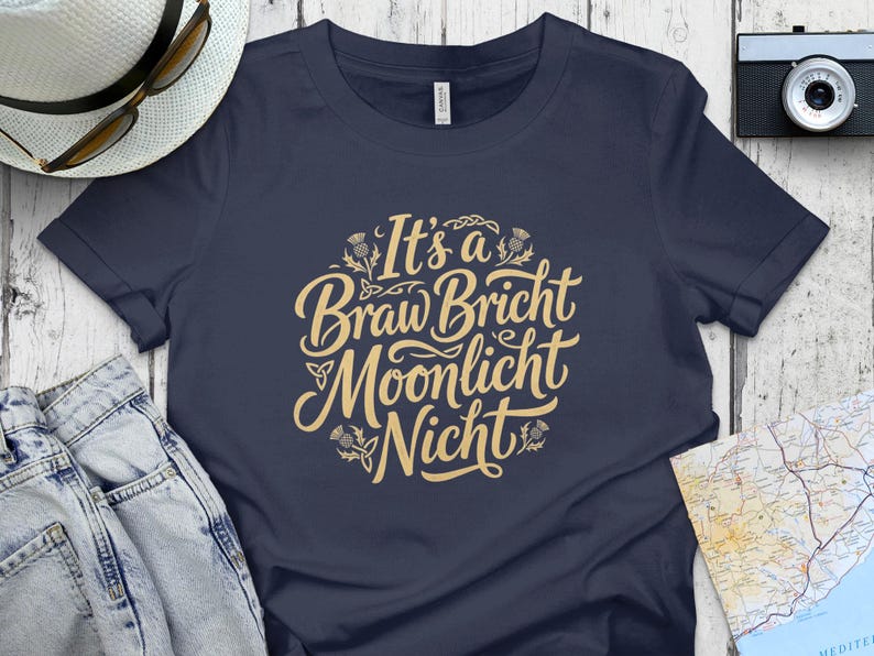 Navy t-shirt with "It's a Braw Bricht Moonlicht Nicht" lettering.
