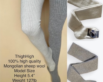 May include: A pair of ribbed thigh-high socks, one white and one gray, made of Mongolian sheep wool. The text reads: ThighHigh 100% high quality Mongolian sheep wool Model Size Height 5.4" Weight 127lb Shoe size 6.5. The socks are shown flat.