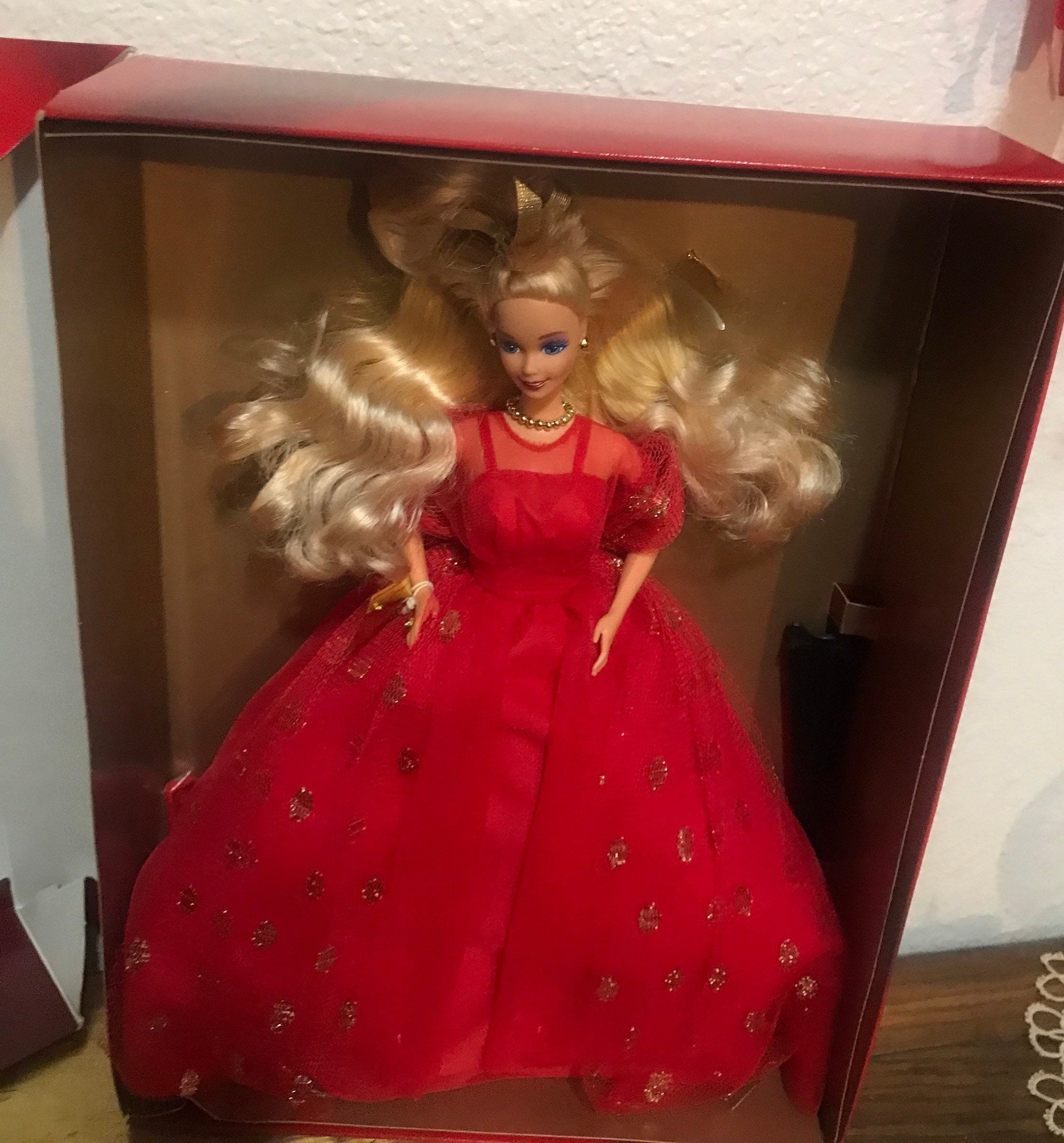 2017 Holiday Barbie, in her own red dress, and the dress from City Shine  Pink Barbie. : r/Barbie