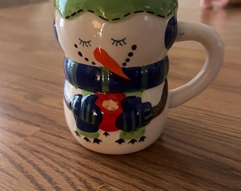 Taza de muñeco de nieve, mitones rojos, taza de chocolate caliente, Bay Island