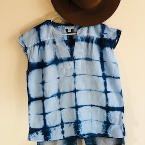 Indigo shibori linen cap sleeve blouse.