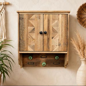 Wooden wall unit with green knob hooks Small Cupboard wall hanging