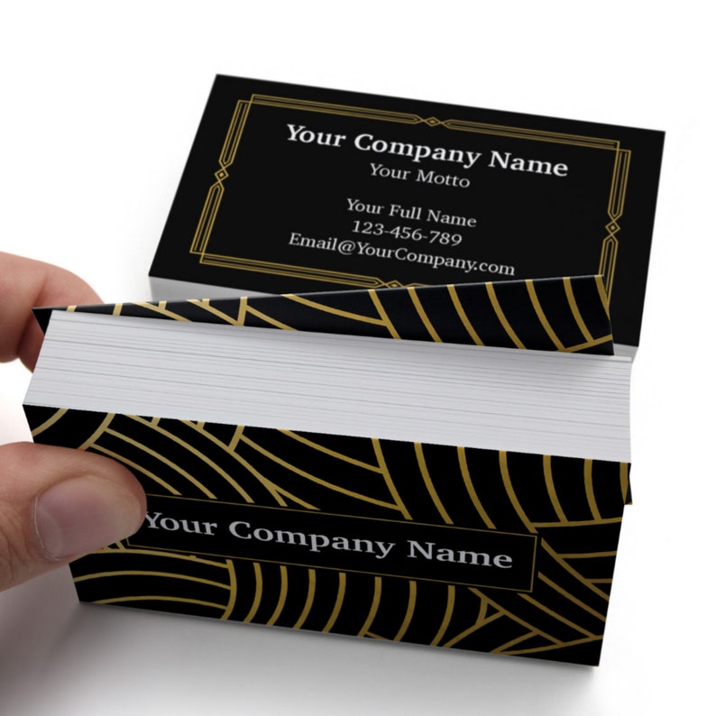 May include: Black and gold business cards with a geometric pattern and the text "Your Company Name", "Your Motto", "Your Full Name", "123-456-789", and "Email@YourCompany.com".