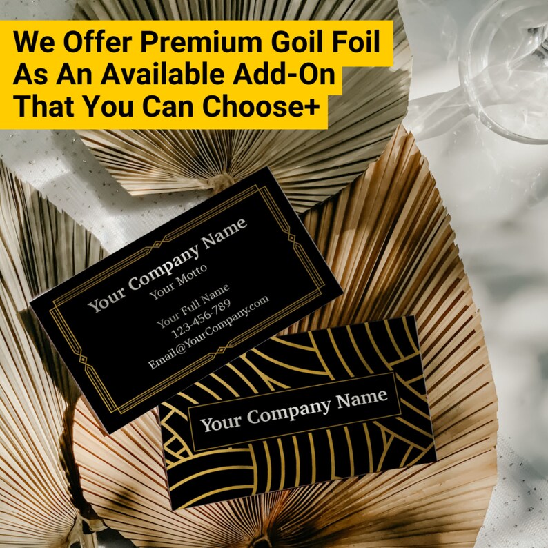 May include: Two black business cards with gold foil accents. The top card has the text "Your Company Name", "Your Motto", "Your Full Name", "123-456-789", and "Email@YourCompany.com". The bottom card has the text "Your Company Name" in gold foil.