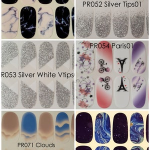 May include: A set of 10 nail wraps featuring different designs. The designs include black and white marble, silver glitter tips, silver glitter with white tips, pink and purple floral with a bicycle and Eiffel Tower, blue and beige clouds, and a dark blue starry night.
