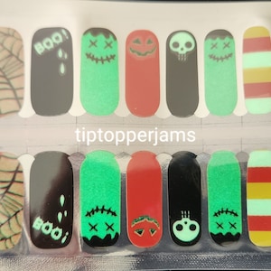 May include: Set of 10 glow-in-the-dark Halloween nail wraps. The wraps feature a variety of designs, including a spiderweb, a ghost, a pumpkin, a skull, and a zombie. The wraps are black, green, red, and yellow.