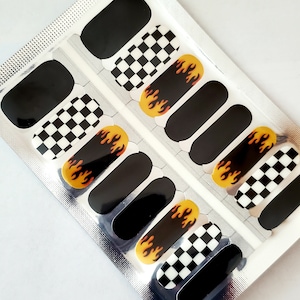 May include: A set of 10 nail wraps featuring a black and white checkered pattern, black flames, and solid black nail wraps.
