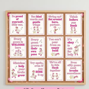 May include: A corkboard displays 12 pink and white classroom posters with goose illustrations and positive affirmations. The posters are framed in a wooden border and feature phrases like "Be proud of yourself, silly one."