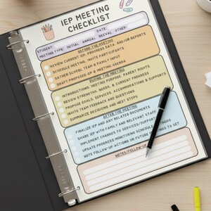 May include: An IEP Meeting Checklist in a black binder, with sections for before, during, and after the meeting. A black pen rests on the checklist, with colorful highlighters and pencils scattered around.