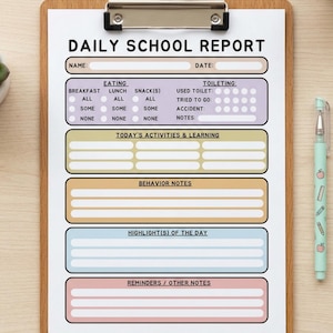 May include: A Daily School Report form on a wooden clipboard with a light green pen. The form features sections for name, date, eating, toileting, activities, behavior, highlights, and reminders, organized in colorful pastel boxes with black text.