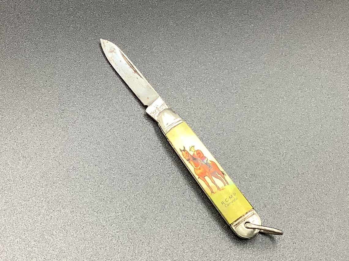 Royal Canadian Mounted Police on mini pocket knife. Etsy