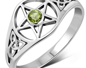 May include: A silver ring with a green gemstone set in a pentagram design. The ring also features a Celtic knot design on the band.