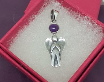 May include: Silver angel pendant with a purple gemstone. The pendant is in a red velvet box.