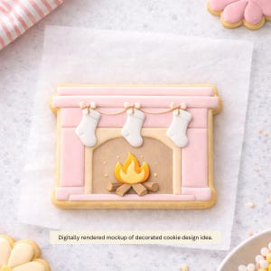 May include: A pink fireplace-shaped cookie decorated with white stockings, a yellow flame, and a brown log. The cookie has a light brown border and is on a white surface. The text "Digitally rendered mockup of decorated cookie design idea." is at the bottom.