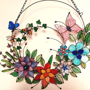 Summer Wreath Stained glass wreath featuring a pink butterfly, orange bee and bright glass flowers, window pendant