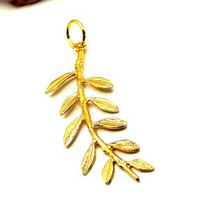 May include: A gold-colored olive branch pendant with a textured finish. The pendant features a delicate stem with multiple leaves.